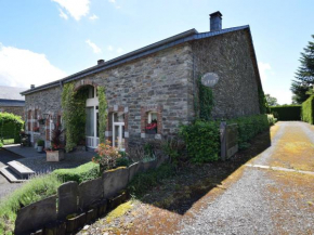 An old farmhouse in a peaceful Ardennes village on the edge of the forest